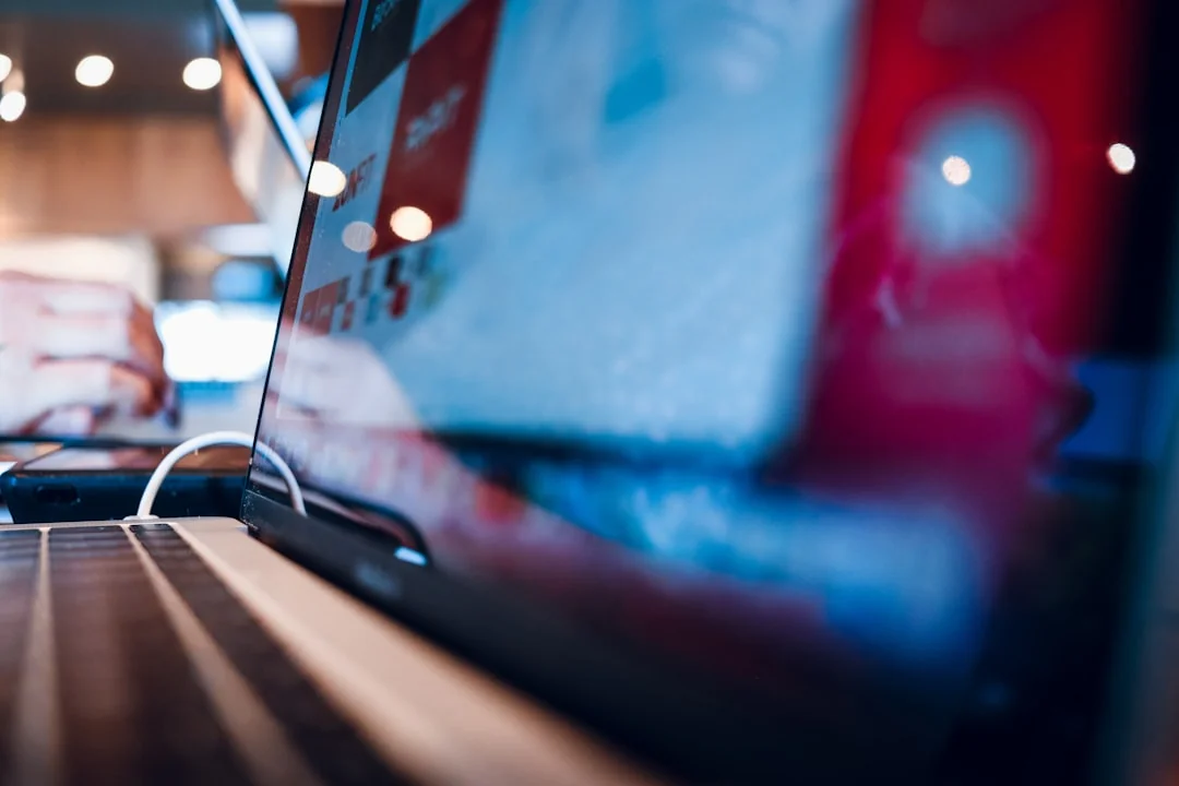 A tablet with a financial website open, alongside a white keyboard and mouse. Ideal for tech-theme stock images.